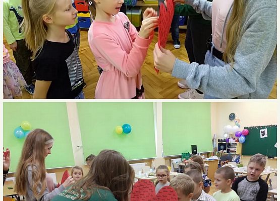 Uczniowie przebijają szpilką papierowe serce