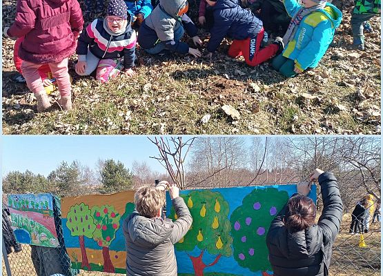 Nauczycielki wraz z dziećmi zawieszają plakaty wiosenne