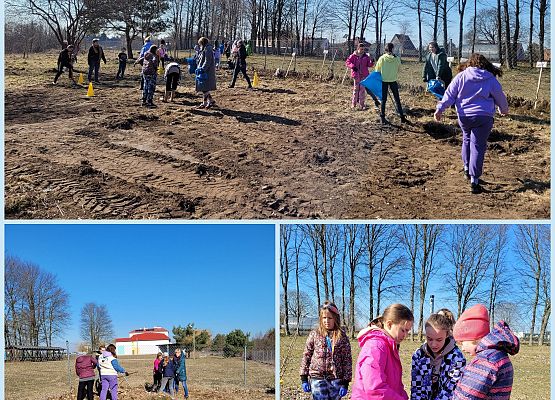 Uczniowie porządkują sad
